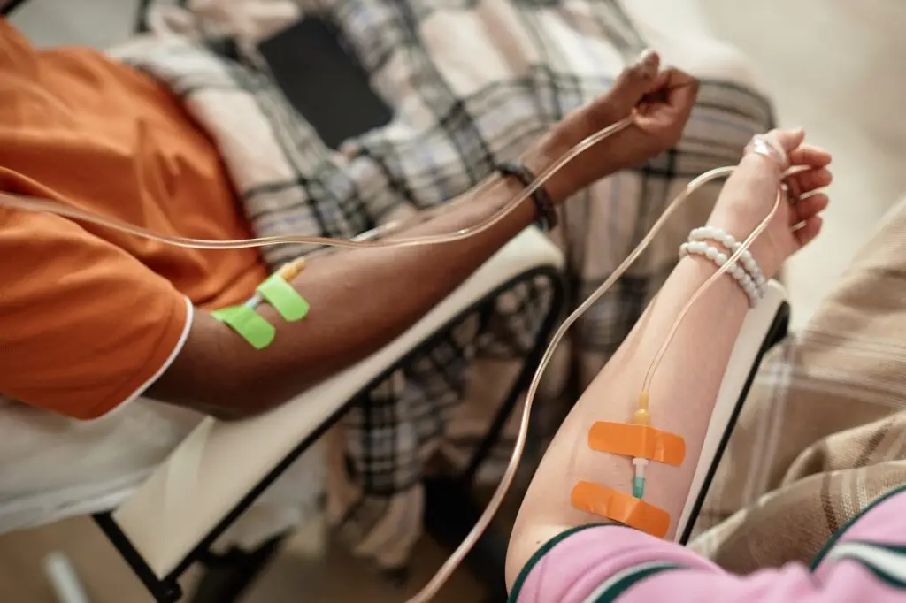 Arms with IV drip infusion