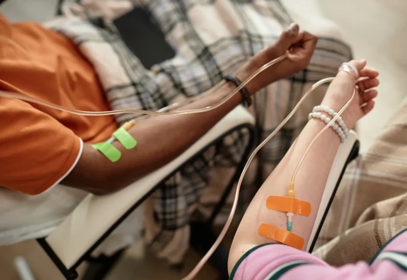 Arms with IV drip infusion
