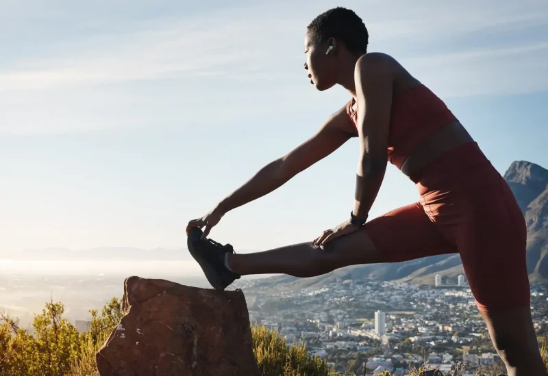 Black woman, stretching and outdoor exercise, workout and training for wellness, health and fitness