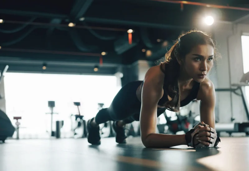 Woman planking at gym for fitness training